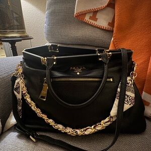 Prada Elegant Black Leather Shoulder Bag with Gold Details
